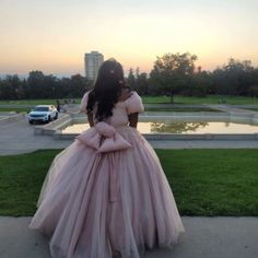 Step Into Elegance With This Stunning Blush Pink Quinceaera Gown. Featuring A Flattering Sweetheart Neckline And Puffed Short Sleeves, This Gown Is Perfect For Making A Grand Entrance On Your Special Day. The Full Tulle Skirt Creates A Dramatic Ball Gown Silhouette, Perfect For Twirling And Capturing Breathtaking Photos. The Back Of The Dress Showcases A Gorgeous Oversized Bow Detail, Adding A Touch Of Feminine Charm. Intricate Lace And Bead Embellishments On The Bodice Add A Layer Of Luxury And Princess Style Gown For Quinceanera, Fitted Princess Dress For Quinceanera, Princess Gown With Sweetheart Neckline, Tulle Quinceanera Dress For Prom, Pink Ball Gown For Prom Season With Fitted Bodice, Pink Ball Gown For Prom With Fitted Bodice, Princess Style Quinceanera Dress For Debutante Ball, Fitted Princess Ball Gown For Bridesmaid, Pink Fitted Bodice Ball Gown For Prom