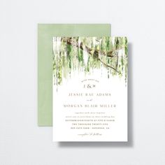 a wedding card with watercolor trees and greenery on the front, in green