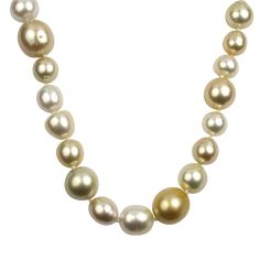 Elevate your style with the luxurious allure of our 18k Yellow Gold Southsea Pearl Necklace. Comprising 76 lustrous gold and ivory pearls, ranging from a classic 8mm to a captivating 15+mm, this necklace exudes opulence and sophistication.Meticulously knotted along the generous 37.5-inch length, each pearl showcases its individual character, creating a mesmerizing interplay of sizes and hues. The rich blend of gold and ivory tones adds a warm and radiant touch to this timeless piece.Fastened wit Luxury Gold Plated Round Pearl Necklace, Luxury Gold-plated Round Pearl Necklace, Luxury 22k Gold Pearl Necklace For Festive Occasions, Luxury Elegant Bridal Necklace With Gold Beads, Luxury Cream Single Strand Jewelry, Luxury Gold Plated Pearl Necklace For Celebration, Luxury Gold Pearl Embellished Necklace, Luxury Gold Pearl Necklace For Festive Season, Luxury Single Strand Cream Jewelry