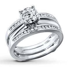 a white gold ring set with diamonds on it