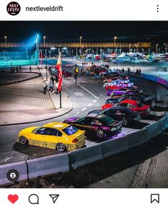 a group of cars parked in a parking lot next to each other on the street