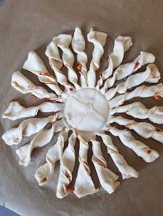 a white plate topped with dumplings on top of a table