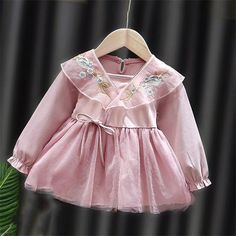 us children's wholesale clothing Baby Girl Embroidery Pattern Solid Color Dress - PrettyKid Fitted Princess Dress With Floral Embroidery For Spring, Pink Embroidered Long Sleeve Dress, Pink Princess Dress With Floral Embroidery For Spring, Sweet Embroidered Cotton Dress, Spring Long Sleeve Embroidered Dress With Ruffles, Spring Long Sleeve Pink Embroidered Dress, Pink Long Sleeve Dress With Floral Applique, Spring Pink Long Sleeve Embroidered Dress, Spring Princess Dress With Floral Embroidery