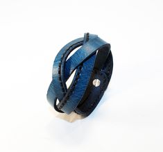 Handmade Blue Leather Bracelet. The leather is cut and dyed, all by hand. Great gift! Very comfortable & easy to wear. Available sizes: 6.5 inches(16.5 centimeters), 7 inches(17.7 centimeters), 7.5 inches(19 centimeters), 8 inches(20 centimeters). Probably about 3 centimeters wide. If you have some questions please write. Fire Nation Symbol, Cord Ties, Some Questions, Leather Cuffs, Blue Bracelet, Blue Leather, Leather Fashion, Handmade Bracelets, Leather Bracelet