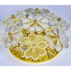 a gold plate with glass flowers on it