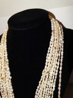 "89 grams weight, Vintage 5 Strands of 46\" lenght each, Rice Pearl Necklace. Excellent condition." Luxury Temple Jewelry Style Pearl Necklace, Pearls Jewelry Indian Kameswari Jewellers, Luxury Traditional Pearl Necklace With Cutdana, Luxury Silver Chandbali Pearl Necklace, Traditional Luxury Pearl Necklace For Women, Luxury Traditional Pearl Necklace For Women, Luxury Pearl Necklace For Diwali Gift, Luxury Bollywood Pearl Necklace For Ceremonial Occasions, Luxury Bollywood Ceremonial Pearl Necklace