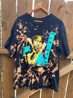 New shirt with image of Ice Cube on the front Distressed bleach detail all over Sz. M Please feel free to ask any questions before purchasing. Tie Dye Graphic Print Top For Streetwear, Tie Dye Tops With Graphic Print For Streetwear, Tie Dye Screen Print Tops For Streetwear, Casual Acid Wash Tops With Graffiti Print, Bleached Crew Neck Top For Streetwear, Bleached Cotton Tops For Streetwear, Bleached Crew Neck Band Merch Top, Relaxed Fit Bleached Tops For Streetwear, Relaxed Fit Bleached T-shirt For Streetwear