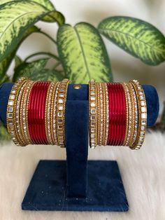 red    Bangles with Kundan Detailing. These stylish bangles are made from copper and feature Kundan  stones.  Features: - Made from copper  - red   - Artificial  Kundan detailing  - Available in size 2.6,2.8,2.10 Adjustable Red Bangle Cuff Bracelet, Red Bangles Set Bridal, Red Jeweled Bangle As A Gift, Traditional Handmade Red Bangle, Red Jeweled Bangle For Gift, Traditional Red Handmade Bangle, Elegant Red Bracelet With Stone Work, Traditional Red Cuff Bracelet As Gift, Elegant Red Bracelets With Stone Work