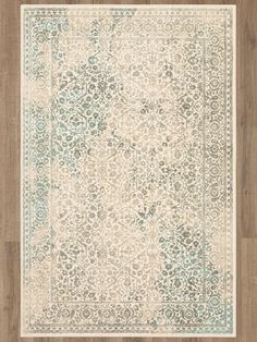 an area rug with wood flooring and blue accents on the top, in front of a