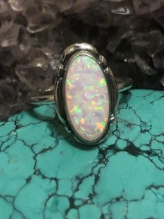 *7x14 mm lab created opal ring *Sterling Silver *Free Shipping *Handcrafted In USA*Jewelry ship in Gift box *Cabochon made vary in color All components are solid .925 silver. Thank You For Your Looking ,And Check Out More Items In My Etsy Shop For More Great Deals, Also We Add More Jewelry To Etsy Shop regularly ❤❤❤PLEASE check their dimensions, before setting the order.►►► NOTE◀◀◀-Once the parcel gets shipped out, it is usually needed 3-6 business days for every where in USPlease keep in mind t Silver Opal Ring With Oval Cabochon, White Oval Opal Ring Hallmarked, Oval White Opal Ring Hallmarked, Unique Adjustable White Opal Ring, White Opal Oval Cabochon Ring, Hallmarked Oval Opal Ring, Handmade White Opal Ring In Sterling Silver, Handmade Oval Opal Ring For Anniversary, Silver Oval Opal Ring Untreated