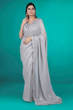 "Get ready to steal the show in this Party Wear Saree D-209! The sequence work adds a touch of glamour to this already stunning piece. Turn heads and make a statement as you strut your stuff in this beautiful saree. Perfect for any special occasion. Extra fabric inside the blouse Waist is stretchable Fitted Georgette Pre-draped Saree For Party, Festive Pre-draped Saree For Party Season, Semi-stitched Saree For Wedding And Party Season, Glamorous Hand Embellished Saree For Festivals, Elegant Pre-draped Saree For Party Season, Silver Georgette Pre-draped Saree For Wedding, Silver Fitted Pre-draped Saree With Zari Work, Fitted Silver Pre-draped Saree With Zari Work, Elegant Silver Pre-draped Saree For Evening