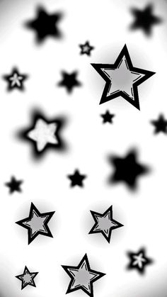 black and white stars are flying in the air