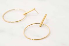 W H A T ∙ M A K E S ∙ T H I S ∙ S P E C I A L Simple but striking, these Minimal Large Circle & Stick Stud Earrings are minimal in design but big on impact. - we use only the finest quality materials - all components are 100% sterling silver or 18k Gold plated (Nickel free) - all pieces are designed in our happy studio D E T A I L S * Available in sterling silver or Crafted in Gold plated .925 sterling silver * Encrusted with zircon stones * Price is per pair * Very easy to put on All jewelr Modern Gold Open Circle Earrings, Minimalist Pierced Open Circle Earrings, Minimalist Open Circle Pierced Earrings, Modern Gold Hoop Linear Earrings, Minimalist Round Linear Earrings For Everyday, Gold Minimalist Open Circle Earrings, Minimalist Gold Open Circle Earrings, Modern Open Circle Pierced Hoop Earrings, Modern Gold Earrings With Simple Design