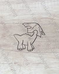 a wooden cutting board with a drawing of a dragon on it's back side