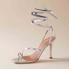 Elevate your wedding ensemble with these stunning silver square toe stiletto heel sandals. The strappy design adds an alluring touch, making them the perfect choice for any glamorous occasion. Color: silver Heel Type: stiletto heel Heel height: 3.14 inches/ 8 cm Toe：square Toe Handcrafted US sizing. Fits true to size. Silver Ankle Strap Wedding Shoes For Summer, Silver Sleek Heels For Summer, Silver Sleek Summer Heels, Sleek Silver Summer Heels, Silver Heels With Single Toe Strap For Summer, Silver Heels With Wrapped Heel And Open Design, Silver Heels With Wrapped Open Heel, Silver Sandals With Wrapped Heel For Wedding, Silver High Heel Sandals For Events