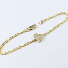 This very fine Gold Delicate Bracelet is setted in 14k solid yellow gold, with top quality lab diamonds. The hart charm is connected with 14k solid gold hallmarked chain, and a secure lobster clasp. Total length approx. 17cm / 6.7". Adjustable closing lengths. This beautiful creation was made with top craftsmanship. Pave hand setted to perfection. Made to a high polish. Luxury gift for yourself or anyone close to your heart. Available in white gold - for no extra charge - please let me know at checkout. * Sent via express shipping with tracking number (approx. 2 business days!) * Comes gift ready, for one very lucky lady. * Brand new - Made to order - Please allow approx. 14 business days to craft.  * If you need the order by a specific date - please let us know * Brand new - made to order 14k Gold Bracelets With Pave Setting For Gift, Diamond Heart Bracelet With Brilliant Cut As Gift, Diamond Heart Bracelets As Gift, Luxury Cubic Zirconia Bracelet For Valentine's Day, Diamond Heart Jubilee Bracelet, Heart-shaped Brilliant Cut Diamond Bracelet, Luxury Cubic Zirconia Heart Bracelet With Jubilee Band, Heart-shaped Cubic Zirconia Diamond Bracelet, Classic Chain Bracelet With Pave Setting As Gift