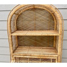 a wicker shelf with two shelves on it