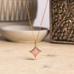 Pink Opal Star Gold Necklace -14k gold filled adjustable dainty chain - Minimalist, cute pink jewelry for daughter, niece, new mom, friend Stone: Genuine Pink Opal Please note due to nature of our genuine stones no two are alike and the ones you will receive will vary slightly from the ones pictured in the photos. Bezel: Vermeil Gold Chain: 14k Gold Filled, 16 to 18 inch adjustable, 1.3mm cable, Spring Ring Clasp Oval Gemstone: 13mm wide x 13mm height About "Gold Filled Jewelry": Also called rolled-gold. These jewelry items are not actually filled with gold. They are made of a base metal covered by sheets of gold in a mechanical bonding process. Effectively a thick coat of gold: the industry standard for the gold content is 5% or 1/20 of the total weight. Made with 14k gold, it is hard wea Star Gold Necklace, Gold Gemstone Necklace, Mom Friend, Dainty Chain, Pink Jewelry, Pink Opal, Gold Filled Jewelry, New Mom, Necklace Earring Set