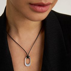 Lean into this contrasting combo, inspired by New York City: a sleek brushed pendant on a 19-inch utilitarian black cord. And with a slider for adjustable length, you can wear it your way.
Material: DD Signature brushed rhodium and high polish edges over high-quality brass.
Length: 14" - 19" (adjustable) Modern Adjustable Gunmetal Jewelry, Adjustable Modern Gunmetal Jewelry, Modern Black Necklace For Everyday Use, Modern Black Necklaces For Everyday Use, Modern Black Necklace For Everyday, Modern Silver Necklace With Adjustable Cord, Modern Black Jewelry With Sliding Knot, Modern Adjustable Length Necklace For Everyday, Modern Adjustable Necklaces For Everyday