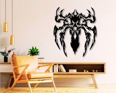 a living room with a chair and wall decal in the shape of a spider