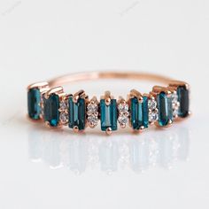 Baguette London Blue Topaz Ring For Women 18k Solid Gold Promise London Blue Topaz Eternity Ring Unique Half Eternity Braided Band Ring Welcome to A1Jewells Experience stunning jewelry which compliments your style everyday, All the items in my shop are hand made items and are crafted by our Master Goldsmith in our workshop, We pay a lot of emphasis on the making of the ring and we always assure you that we will provide best quality products every time toy you, Detailed description of the product Blue Topaz Wedding Band, Braided Ring Band, Birthstone Band, Topaz Engagement Ring, London Blue Topaz Ring, Rose Gold Wedding Bands, Gold Wedding Band, Blue Topaz Ring, London Blue Topaz