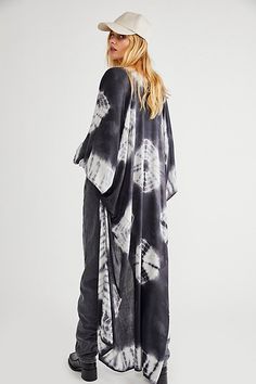 In a super soft fabric and tie dye pattern this oversized maxi kimono features statement cutout detailing under the arms. Flowy Unlined Beachwear Cover-up, Bohemian Flowy Unlined Cover-up, Flowy Bohemian Unlined Cover-up, Maxi Length Cover-up For Beach Loungewear, Oversized Maxi Cover-up For Beach Season, Flowy Long Breezy Cover-up, Chic Flowy Maxi Length Cover-up, Flowy Maxi Dress With Kimono Sleeves, Flowy Long Cover-up For Festival