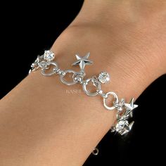 "PERFECT CHRISTMAS GIFT FOR LADIES You are getting a Star chain bracelet with lots of dangling stars and dangle Swarovski crystals. The chain has very large circle, so you can adjust the length easily. It is long enough to be an anklet if you have a petite size ankle. Chain length: 8\" (19.8cm). Crystal Color: Crystal Clear Prices are in US$. For shipping policies and other important information, click on \"profile\" on the right. See an item that you like but has already been sold? Contact me t Party Charm Bracelet With Dangle, Silver Star Charm Bracelets For Party, Silver Star Charm Bracelet For Party, Silver Bracelet With Star Charm For Party, Silver Party Bracelet With Star Charm, Party Bracelets With Star Charm, Party Bracelets With Star Charm In Metal, Silver Star-shaped Jewelry For Birthday, Silver Star Shaped Jewelry For Birthday