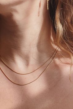 Sleek and minimal, this 1mm thick snake chain is great for layering with other necklaces. Add a pendant to it or wear it by itself. - Sterling Silver or 14K Gold-Filled - 16" or 18" long Jewelry Care All items, excluding one-of-a-kind and ready-to-ship pieces, are Made to Order and take 1-4 weeks to process before shipping. Items currently in stock will ship within 1-5 business days. All items are final sale. Please confirm your ring size before purchasing. Dainty Tarnish Resistant Snake Chain Necklace, Dainty Tarnish-resistant Snake Chain Necklace, Minimalist Snake Chain Necklaces For Layering, Minimalist Double Chain Herringbone Necklace, Dainty Snake Chain Necklace, Layering Snake Chain Necklace, Minimalist Snake Chain Necklace For Layering, Dainty Snake Chain Necklace For Layering, Snake Chain