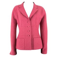 A 2000s Chanel boucle woollen jacket in a punch pink with a tailored bodice composed of curved exposed dart seams, creating a flattering silhouette on the body. The bodice includes a notched lapel collar, pockets and is fastened with self-covered buttons down the centre front. Finally, the jacket features the final iconic Chanel feature; the chain weight along the bottom hem to weigh it down. This item carries the Chanel authenticity label. 2000s Chanel, Chanel Skirt Suit, Caroline Abbott, Vintage Blazers, Pink Tweed Jacket, Punch Pink, Panel Jacket, Chanel Skirt, Chanel Suit