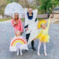 three adults and two children dressed up in costumes