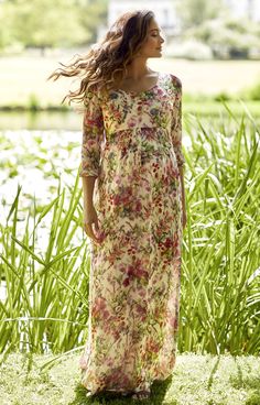 Floaty and feminine, our new Lucy Maternity Maxi Dress in Wildflower Garden is a dream to wear. Designed in a light and elegant fabric, the Lucy is wonderfully bohemian in feel. Longer sleeves offer a little extra coverage for cooler spring days, while the empire line flatters your waist at every stage of pregnancy. Perfect for summer weddings or throw-on a denim jacket and sandals for instant weekend style. Floral maxi dress with sleeves Boho style Light and floaty fabric Flattering scoop neckl Bohemian Floral Print Dress With Empire Waist, Feminine Maxi Dress With Empire Waist For Garden Party, Spring Bohemian Empire Waist Dress, Bohemian Spring Dress With Empire Waist, Bohemian Maxi Dress With Empire Waist For Garden Party, Bohemian Empire Waist Spring Dress, Bohemian Empire Waist Dresses For Spring, Bohemian Empire Waist Dress For Garden Party, Bohemian Floral Print Wedding Dress