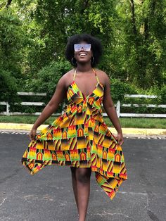 This kente Dress is gorgeous for the summer and very vibrant. Dress is halter style Has adjustable strings that tie to the neck and back Dress is high low style Material is light weight Very comfortable fit Strings can be tied at the shoulder or back Attention grabbing dress. Can be worn at the beach To parties and cook outs Fitted Multicolor Sundress With Tie Back, Multicolor Halter Neck Beach Dress, Multicolor Backless Sundress For The Beach, Yellow Sundress Halter Dress For Beach, Multicolor Backless Sundress For Beach, Backless Multicolor Sundress For Beach, Yellow Beach Sundress Halter Dress, Multicolor Backless Beachwear Dress, Yellow Halter Sundress For Beach