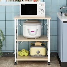 a microwave oven sitting on top of a shelf next to apples and an apple slice