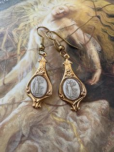 Awesome vintage glass repousse Cameo earrings recovered from old warehouse jewelers stock never in circulation. Condition: excellent!   If you buy more than 5 or more items in the store, shipping is FREE. Old Warehouse, Grecian Goddess, Cameo Earrings, Horseshoe Bend, Vintage Gold, Jewelry Earrings Dangle, Dangle Drop Earrings, Gold Plate, Dangle Earrings