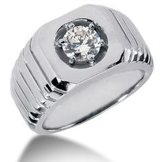 a white gold ring with a diamond in the center