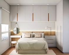 a bedroom with white walls and wooden flooring