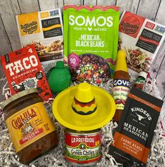 an assortment of mexican food and condiments in a basket