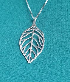 "All pieces are sent in a giftbox and placed in a netted, organza bag, ready for gift giving! Sweet sterling silver leaf pendant with 16\"-18\" - depending on availability and styles of chain may differ. Chain included. Chain styles may vary." Hypoallergenic Leaf-shaped Jewelry Gift, Handmade Silver Leaf-shaped Necklace, Silver Leaf-shaped Necklaces For Gift, Silver Leaf-shaped Necklace Gift, Silver Leaf-shaped Necklace For Gift, Sterling Silver Leaf Necklace, Sand Dollar Necklace, Pendant With Chain, Leaf Necklace