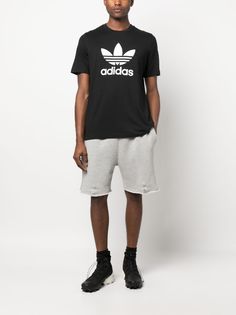 Adidas logo-print Detail T-shirt - Farfetch Adidas Relaxed Fit T-shirt With Three Stripes, Adidas Cotton T-shirt For Streetwear, Logo Detail Short Sleeve T-shirt For Streetwear, Adidas Athleisure T-shirt For Streetwear, Short Sleeve Logo T-shirt In Athleisure Style, Casual Crew Neck T-shirt With Logo, Casual Cotton T-shirt With Logo, Adidas Urban T-shirt For Streetwear, Black Graphic Tee With Logo Detail