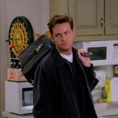 a man holding a briefcase in his hand and looking at the camera with an angry look on his face