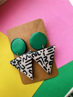 Beautiful afrocentric statement earrings Hand-painted design, handcrafted using natural wood, acrylic paint and resin.  Lightweight and sturdy, comfortable to wear all day.  Minimalistic design and a wonderful gift for yourself or someone special