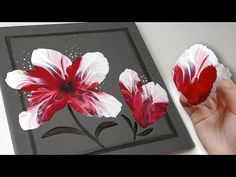 a painting with red and white flowers painted on it's side, next to the words one - touch technique