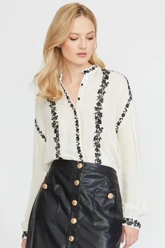 Elevate your style with our Embroidered Edge Stand Collar Blouse! This sophisticated blouse features exquisite cream embroidery details that add a touch of artisanal charm, making it perfect for both professional settings and casual outings. Make a statement and feel confident in this must-have piece! Details: Long sleeves with a button Front buttons Cream embroidery on black blouse and Black embroidery on cream Fabric content: 100% Viscose Care: Dry clean only Embroidered Edge Long Sleeve Shirt Embroidery On Black, Embroidered Edge, Stand Collar Blouse, Cream Embroidery, Comfy Sets, Black Embroidery, Cream Fabric, Couture Details, Charm Making