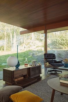 a living room with furniture and large windows