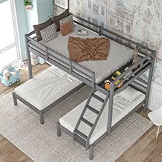 a bunk bed with two mattresses underneath it and a ladder to the bottom level