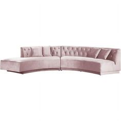 a pink sectional couch with buttons on the back and arms, in front of a white background