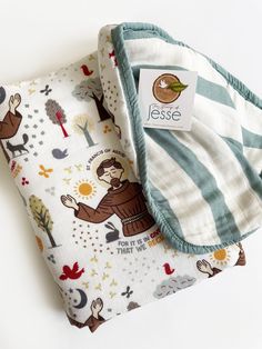 "St. Francis of Assisi Muslin Deluxe Quilt 8 layers 30% Cotton and 70% bamboo. Double sided: Pattern of St. Francis on one side and stripes on the back Size: 47\"x47\" Great for crib, carseat, stroller, etc.. Machine Wash in Cold water Tumble dry low Keep away from velcro For more Catholic gifts visit www.thestumpojesse.com Follow me on Instagram @thestumpofjesse" Catholic Baby Gifts, Carseat Stroller, St Francis Of Assisi, Francis Of Assisi, Catholic Gifts, St Francis, Blanket Baby, Throw Quilt, Future Kids