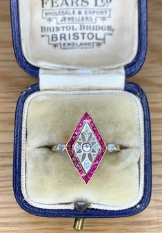 We have for sale a Wonderful Art Deco Ruby & Diamond Marquise Shaped Ring Circa 1930's. The ring consists of a channel set ruby design with diamonds. All of the ruby stones are nice and bright ruby red in colour. The diamonds on the ring are also all nice and bright white in colour and really complement the ruby gemstones. The dimensions of the head of the ring are 20mm by 15mm. The ring tests as 18ct yellow gold with the diamonds being set in white gold. The ring is in very good condition with Art Deco Ruby Ring With Diamond Details, Vintage Multi-stone Diamond Rings, Vintage Multi-stone Diamond Ring Collectible, Vintage Multi-stone Diamond Ring For Collectors, Vintage Diamond Ruby Ring For Collectors, Vintage Ruby Ring With Diamond For Collectors, Vintage Marquise Cut Gemstone Rings, Art Deco Ruby Ring With Diamond, Vintage Ruby Diamond Ring Stamped 14k