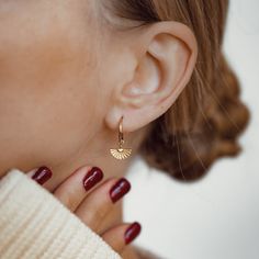 This is a customizable pair of fine hoop earrings made from 18 karat gold-plated sterling silver, with small, fan-shaped earring charms, detail lines engraved into their surface. Perfect for mixing and matching with other hoop earrings or charms to build your own unique earring stack.  Also available in silver or rose gold: https://www.etsy.com/listing/1077143876/fan-charm-hoop-earrings-sterling-silver 🎁 Packaging: Beautifully packed in a box, ready for gifting. 🏷️ This product is made of sterling silver -- easily recognizable by its '925' stamp of authenticity. It is also hypoallergenic, making it suitable for people with sensitive or irritable skin. We recommend avoiding perfume, deodorant or other chemicals. Details: ✅ Material: 925 sterling silver with 18K gold plated or 18K rose gol 14k Rose Gold Filled Huggie Earrings As Gift, Yellow Gold Hoop Earrings With Lever Back For Gift, Gift Rose Gold 14k Gold Filled Huggie Earrings, Gift 14k Gold Filled Rose Gold Hoop Earrings, Gift Rose Gold 14k Gold Filled Hoop Earrings, Modern 14k Gold Filled Huggie Earrings For Gift, Modern 14k Gold Filled Huggie Earrings As Gift, Gift Rose Gold Hoop Earrings 14k Gold Filled, Rose Gold Plated Drop Earrings