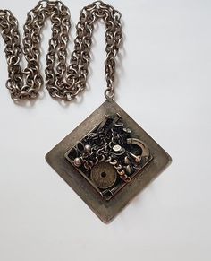 Vintage Brutalist Silver K-J.B. Denmark NecklaceFabulous vintage Brutalist design, a silver plate necklace with unusual and daring Brutalist designBig and chunkyGood condition, does have some ag patinaSigned Design K-J.B. DenmarkThe chain measures about 36" end to end, the pendant measures about 2.25"Very different and fun pieceThanks For Shopping Unique Metal Chain Necklace As Gift, Vintage Handmade Metal Chain Necklace, Handmade Vintage Metal Chain Necklace, Formal Silver Brass Chain Necklace, Silver Necklace With Square Pendant, Formal Metal Necklace With Oxidized Finish, Formal Oxidized Metal Necklace, Silver Necklace With Oxidized Finish And Square Pendant, Silver Brutalist Jewelry For Formal Occasions